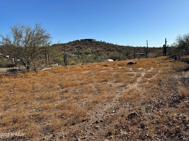 mountain view featuring a rural view