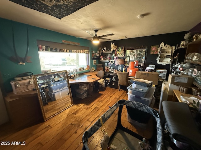 interior space with hardwood / wood-style flooring and ceiling fan