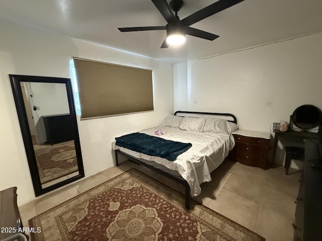 tiled bedroom with ceiling fan