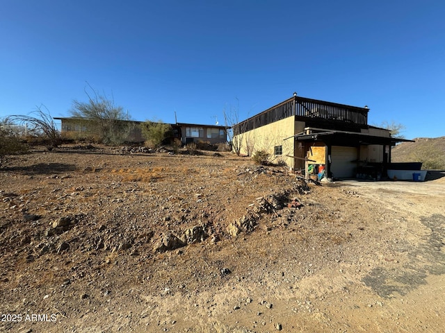 view of property exterior featuring a wooden deck