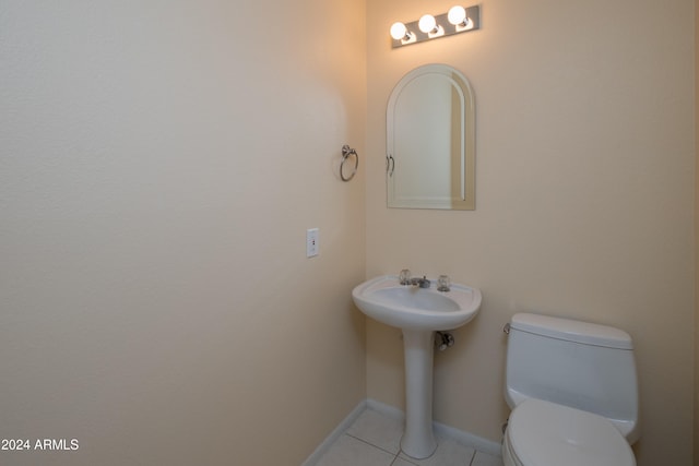 bathroom featuring tile patterned floors, sink, and toilet