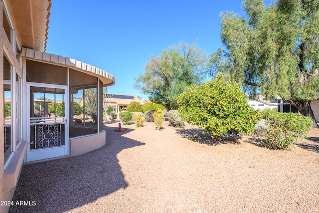 view of yard featuring a sunroom