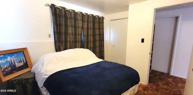 carpeted bedroom with a closet