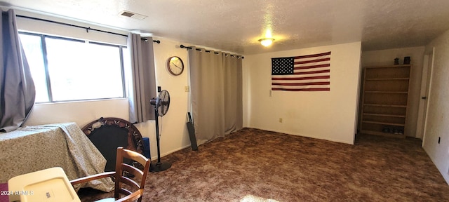 interior space with a textured ceiling