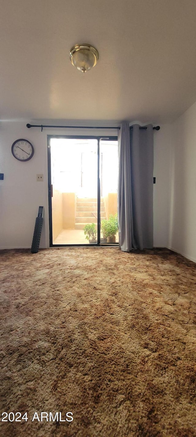 empty room featuring carpet flooring