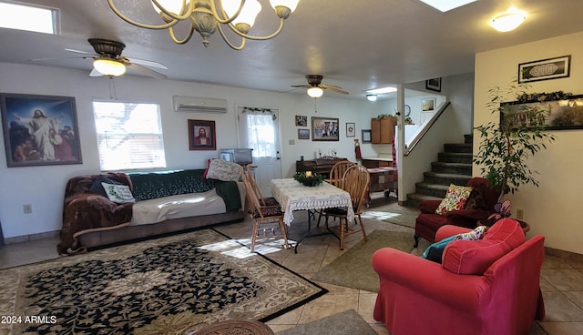 tiled living room with ceiling fan with notable chandelier and a wall mounted AC