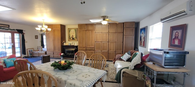 dining room featuring a wall mounted AC and ceiling fan with notable chandelier