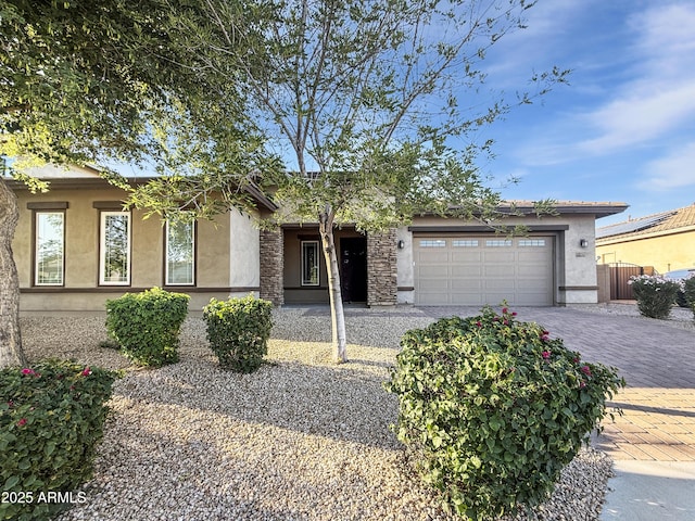 14572 W Medlock Dr, Litchfield Park, AZ 85340 - view of front of property featuring stucco siding, a garage, and decorative driveway