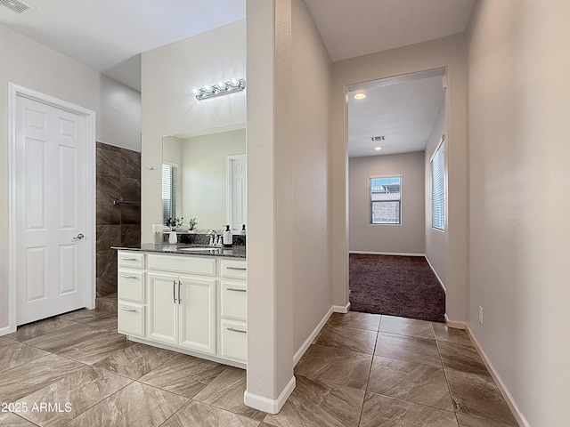 14572 W Medlock Dr, Litchfield Park, AZ 85340 - full bath with marble finish floors, vanity, a walk in shower, and baseboards