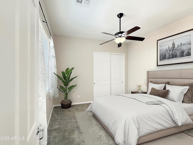 14572 W Medlock Dr, Litchfield Park, AZ 85340 - carpeted bedroom featuring a closet, baseboards, and a ceiling fan