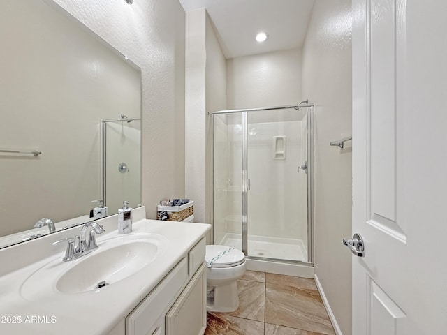 14572 W Medlock Dr, Litchfield Park, AZ 85340 - bathroom featuring toilet, a shower stall, vanity, and baseboards