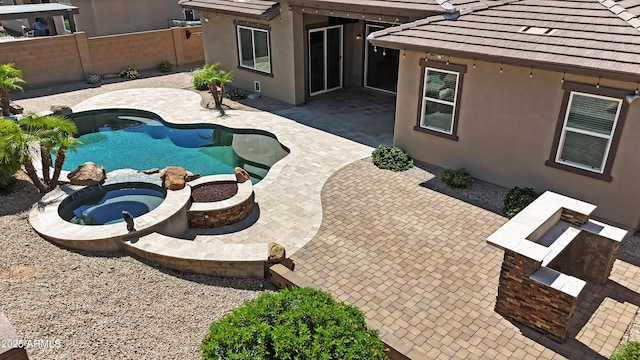 14572 W Medlock Dr, Litchfield Park, AZ 85340 - view of swimming pool featuring a fenced backyard, a patio area, and a pool with connected hot tub