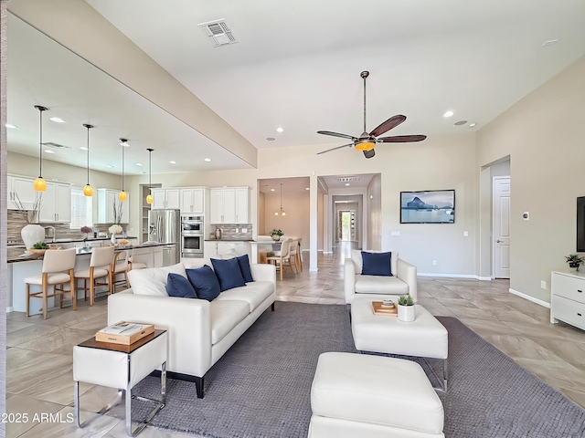 14572 W Medlock Dr, Litchfield Park, AZ 85340 - living room featuring a ceiling fan and recessed lighting