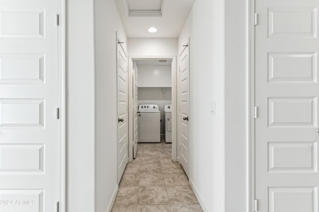 corridor featuring washing machine and dryer