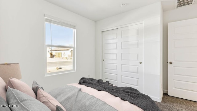 carpeted bedroom featuring a closet