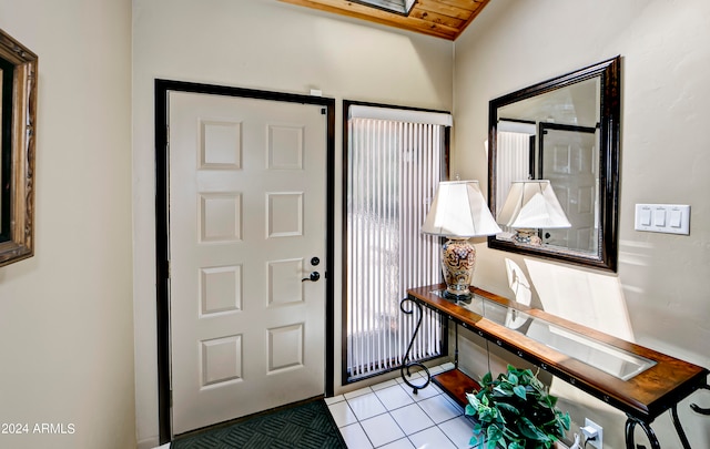 tiled entrance foyer with wood ceiling