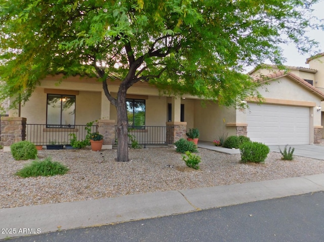 view of front of home with a garage and a porch