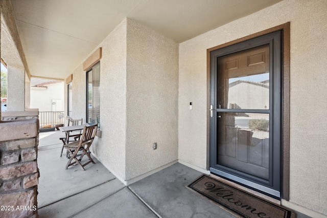 property entrance featuring a porch