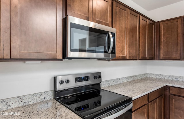 17857 W Getty Dr, Goodyear, AZ 85338 - kitchen with appliances with stainless steel finishes and light stone counters