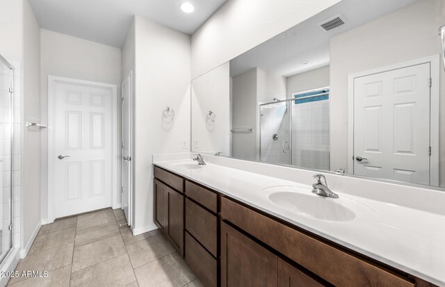 17857 W Getty Dr, Goodyear, AZ 85338 - bathroom featuring vanity, an enclosed shower, and tile patterned flooring