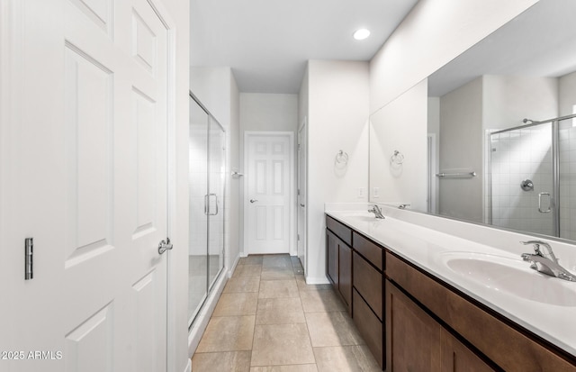 17857 W Getty Dr, Goodyear, AZ 85338 - bathroom featuring vanity, tile patterned flooring, and a shower with shower door