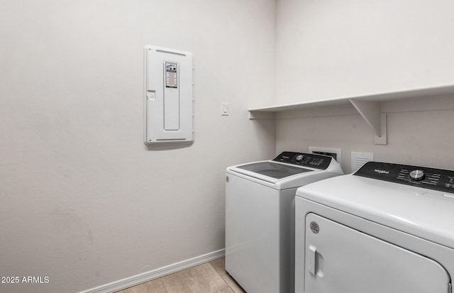 17857 W Getty Dr, Goodyear, AZ 85338 - washroom with electric panel, light wood-type flooring, and washer and clothes dryer