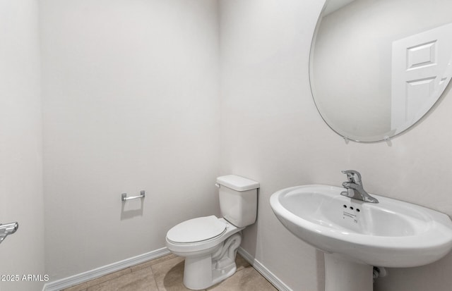 17857 W Getty Dr, Goodyear, AZ 85338 - bathroom featuring sink, toilet, and tile patterned floors