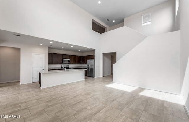 17857 W Getty Dr, Goodyear, AZ 85338 - unfurnished living room with a high ceiling