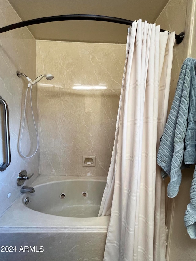 bathroom featuring shower / tub combo with curtain