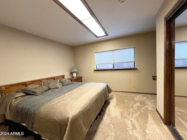 bedroom with light colored carpet