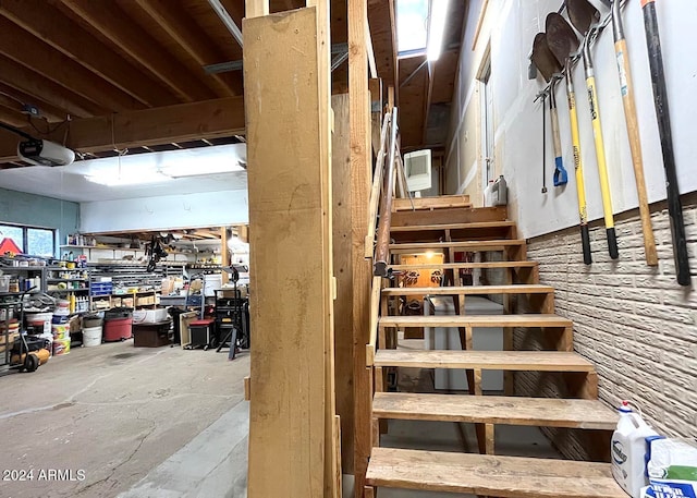 staircase featuring a workshop area