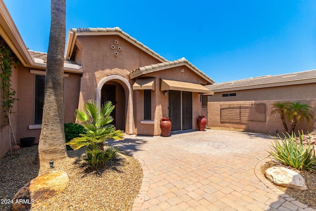 view of front of property with a patio area