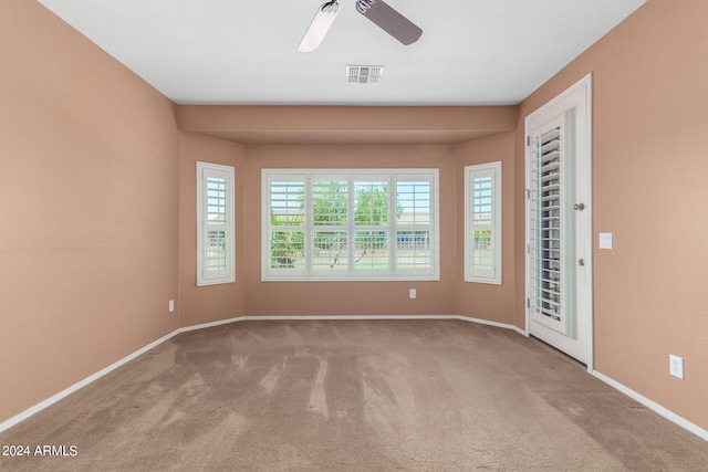 unfurnished bedroom featuring ceiling fan and carpet