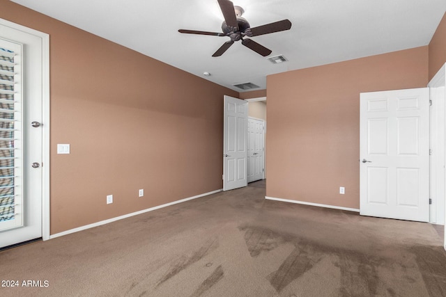 unfurnished room featuring carpet floors and ceiling fan