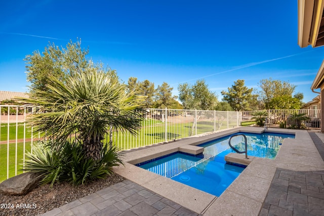 view of swimming pool with a yard, a fenced backyard, a fenced in pool, and an in ground hot tub