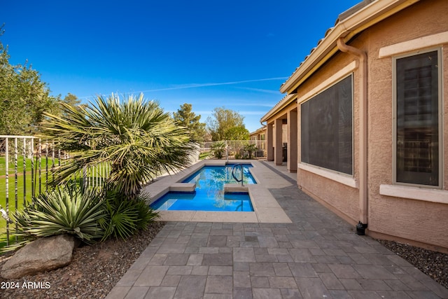 view of swimming pool with a patio, fence, and a fenced in pool