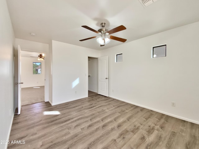 1274 W Dexter Way, San Tan Valley, AZ 85143 - interior space featuring wood finished floors, ceiling fan, and baseboards