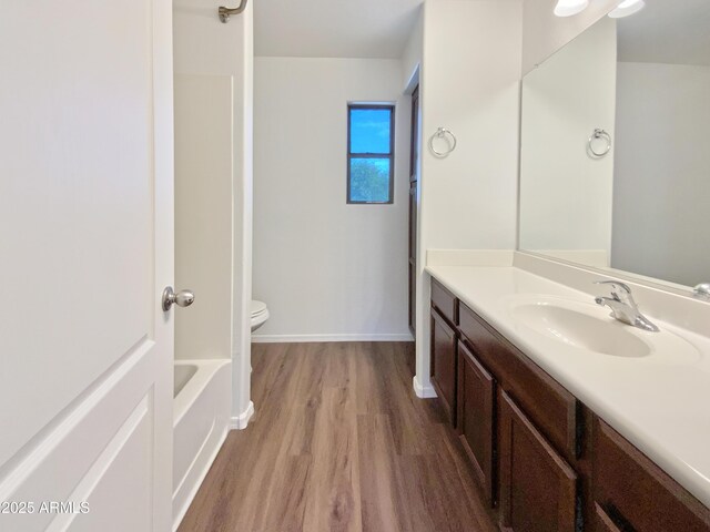 1274 W Dexter Way, San Tan Valley, AZ 85143 - full bathroom featuring toilet, vanity, wood finished floors, and baseboards