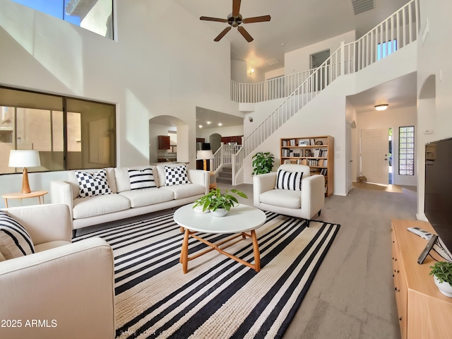 1274 W Dexter Way, San Tan Valley, AZ 85143 - living area with a high ceiling, stairs, arched walkways, and ceiling fan