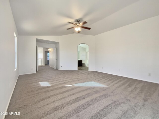 1274 W Dexter Way, San Tan Valley, AZ 85143 - interior space featuring baseboards, arched walkways, carpet floors, and vaulted ceiling