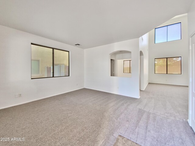1274 W Dexter Way, San Tan Valley, AZ 85143 - unfurnished room featuring visible vents, carpet flooring, and arched walkways