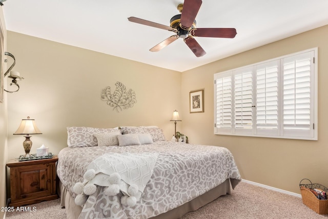 bedroom with light carpet, ceiling fan, and baseboards