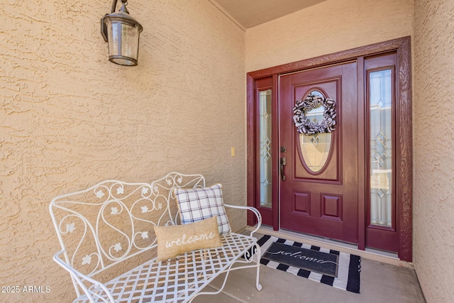 property entrance featuring stucco siding