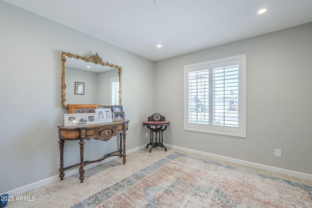 interior space with baseboards, recessed lighting, and a wealth of natural light