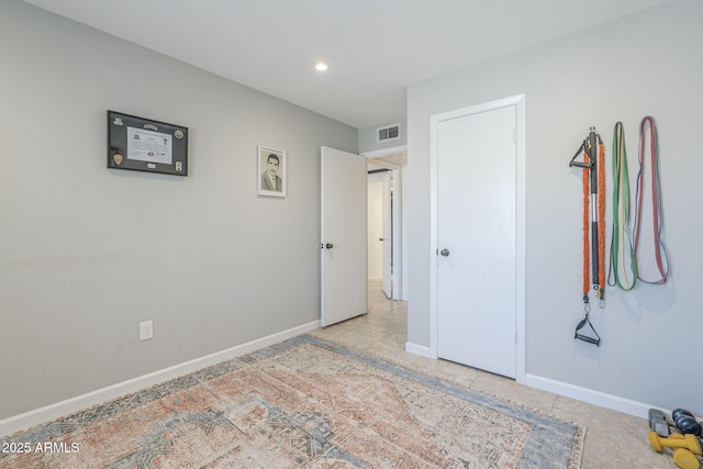 unfurnished bedroom featuring baseboards, visible vents, and recessed lighting