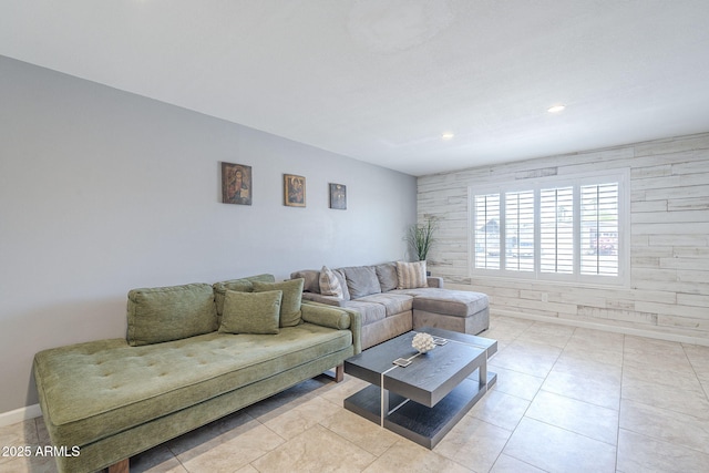 living area with baseboards, recessed lighting, and light tile patterned floors