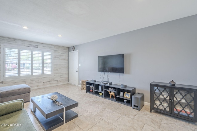 living room featuring recessed lighting and baseboards