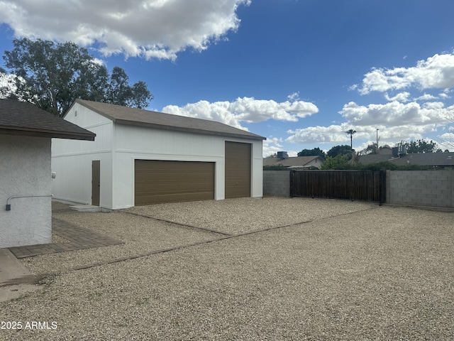 detached garage with fence