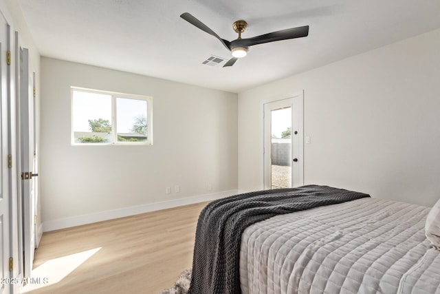 bedroom featuring a ceiling fan, baseboards, visible vents, and light wood finished floors