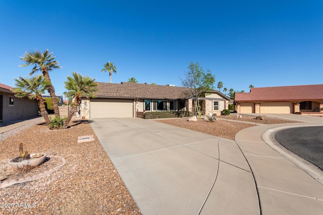 single story home featuring a garage